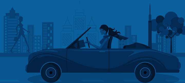 Woman driving convertible in city